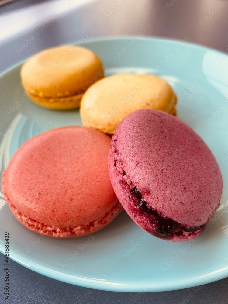 macaroons on a table, blue plate macaroons on a table, blue plate