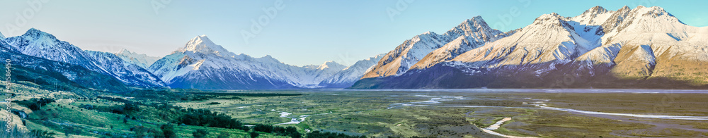  A panorama of a mountain range with a flat valley and color gradient 