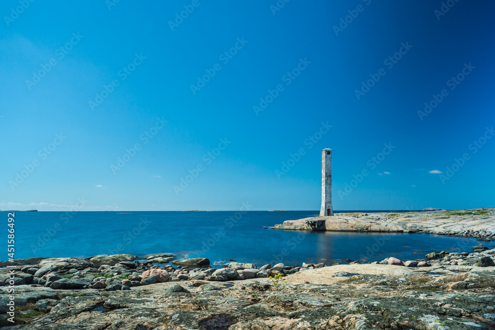 Abandoned lighthouse on a small peninsula. Abandoned lighthouse on a small peninsula.