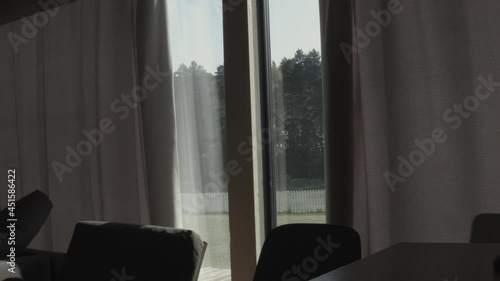 fully open curtains on a window in a modern room