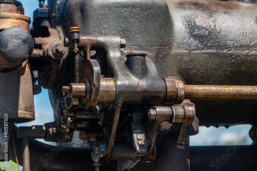 Canandaigua NY Steam Engine Association Pageant of Steam on Saturday, Aug 14, 2021. Close-up of the oil and grease covered antique engine at the show. in Upstate NY. Antiques on display.