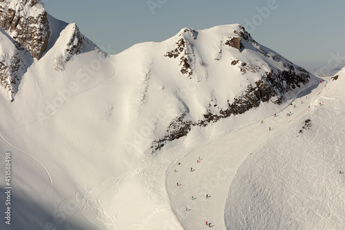 panorama of the perfect ski slope. a ski resort high in the mountains after a big snowfall. prepared track for snowboarding and skiing photo