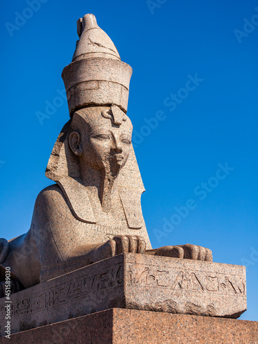 St. Petersburg  Russia  July 23  2021. View of the Neva River and embankment. Sculpture of a stone ancient Egyptian Sphinx