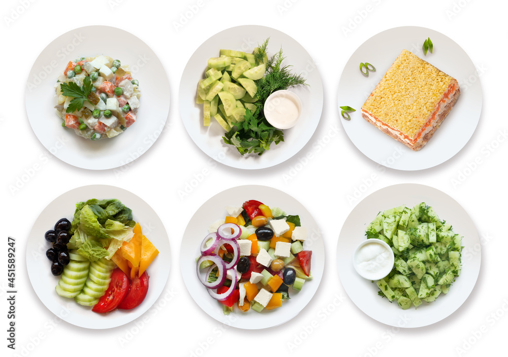 a set of different salads top view on a white background. It includes olivier salad, Greek salad, mimosa salad, fresh vegetable salad. a set of different salads top view on a white background. It includes olivier salad, Greek salad, mimosa salad, fresh vegetable salad.