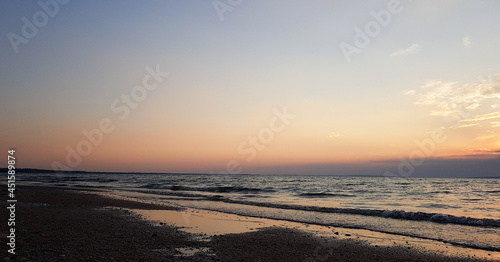 colorful sunset on the sea on a sandy beach. summer vacation by the ocean