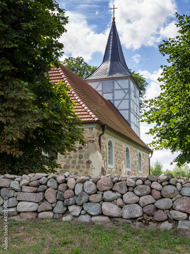 Church of the village Alt Plestlin in Mecklenburg Vorpommern, Germany. The church is especially for water hikers who travel by canoe on the Peene River. photo