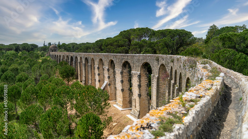 Tomar, Portugal - April 2018: Pegoes aqueduct by the Castle and Convent of the Order of Christ photo