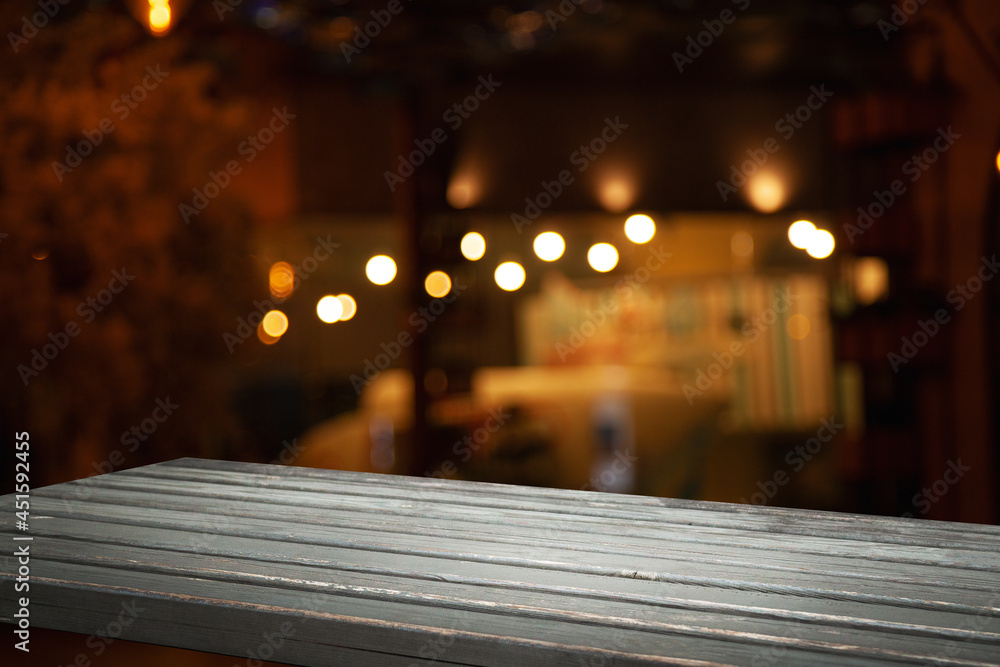 empty wooden table on blurred light gold bokeh cafe restaurant bar, place for your products on the table. empty wooden table on blurred light gold bokeh cafe restaurant bar, place for your products on the table.