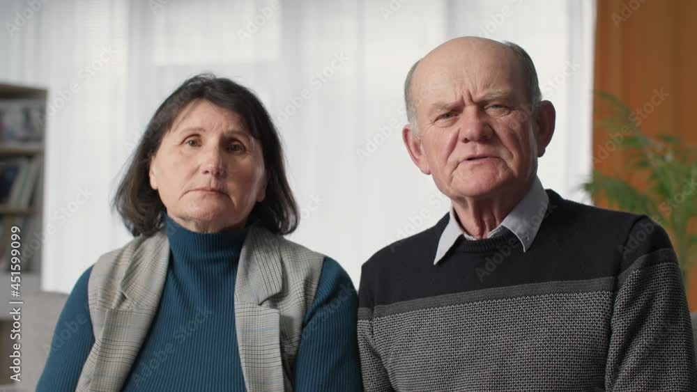 modern medicine, elderly married couple feeling unwell consult doctor online via video link laptop, look at camera modern medicine, elderly married couple feeling unwell consult doctor online via video link laptop, look at camera
