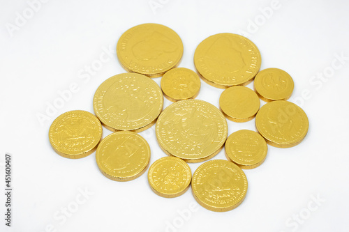 Golden coins chocolate isolated on white background.