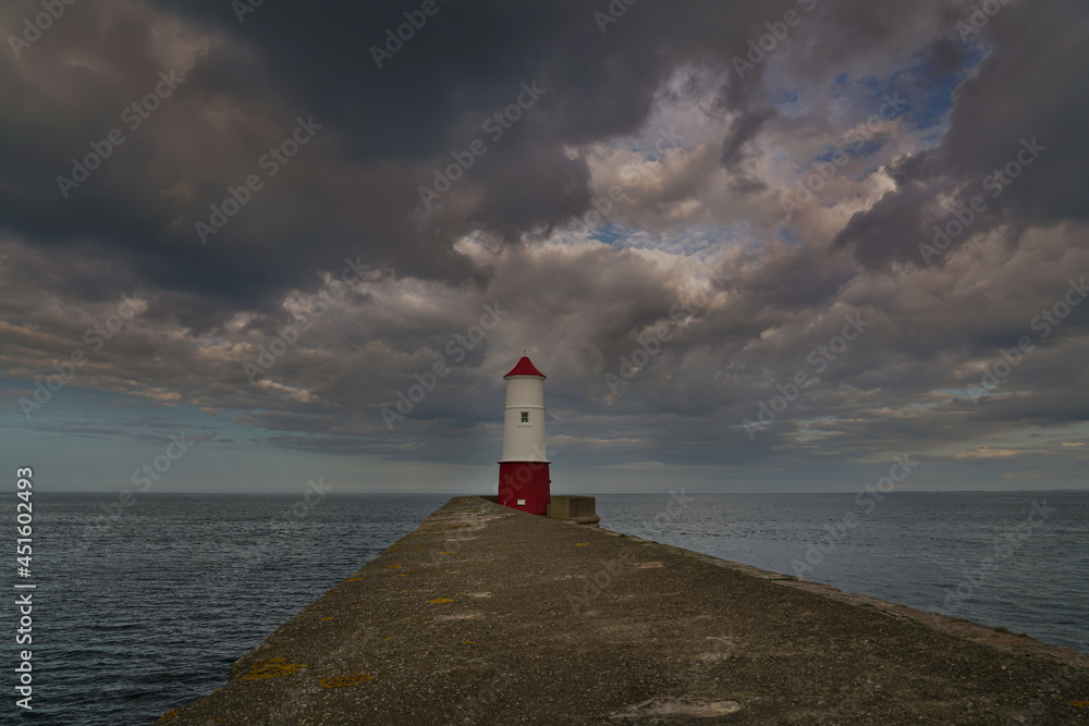 Berwick Upon Tweed lighthouse with dramatic skies above. located in Northumberland, England.