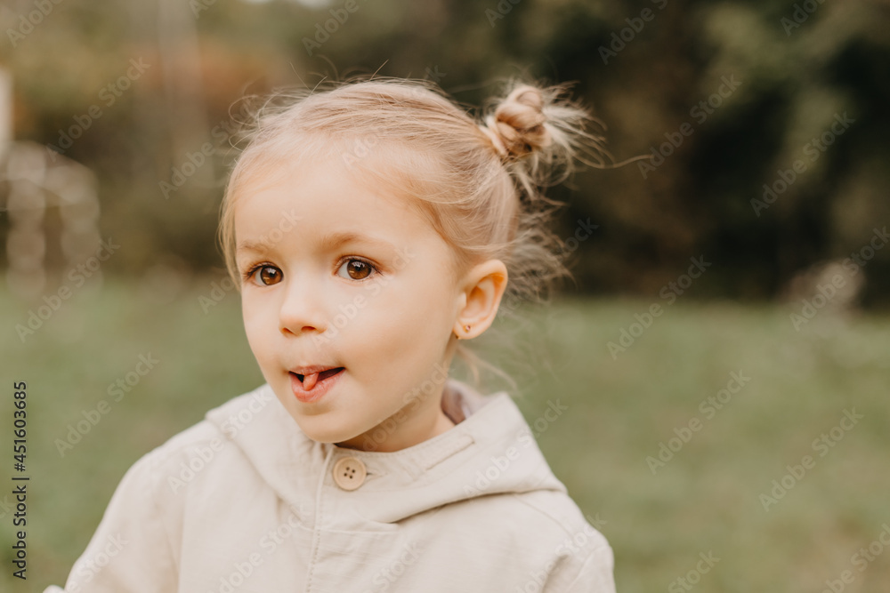 portrait of a girl who grimaces, shows different emotions when walking in the autumn park portrait of a girl who grimaces, shows different emotions when walking in the autumn park