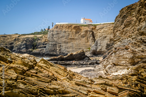 Cliffy beach in Zambujeira Do Mar, Vincentina Coast Natural Park, Alentejo, Portugal photo