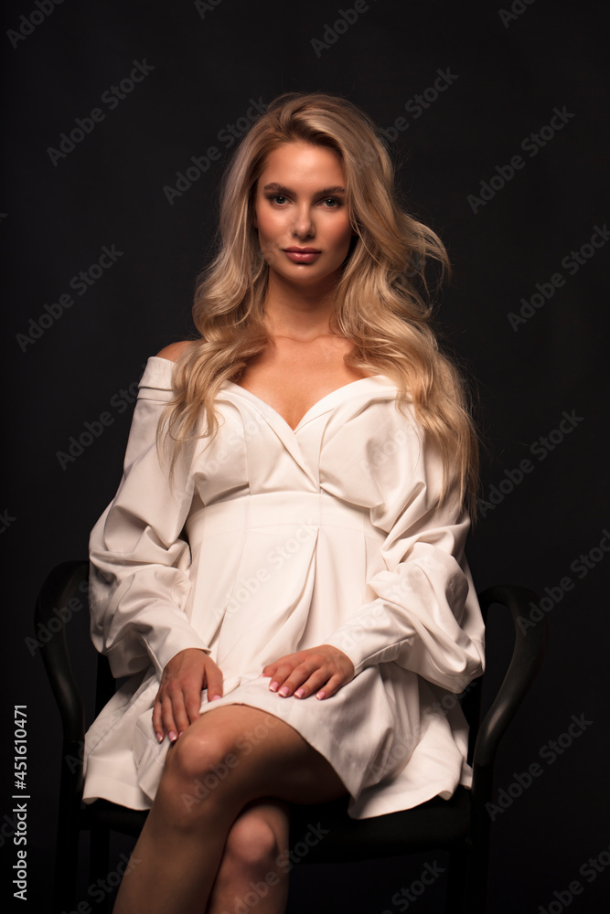Beauty girl with blond hair. Presenting your product. Wavy hairstyle. Beauty, cosmetology and cosmetics Beauty girl with blond hair. Presenting your product. Wavy hairstyle. Beauty, cosmetology and cosmetics