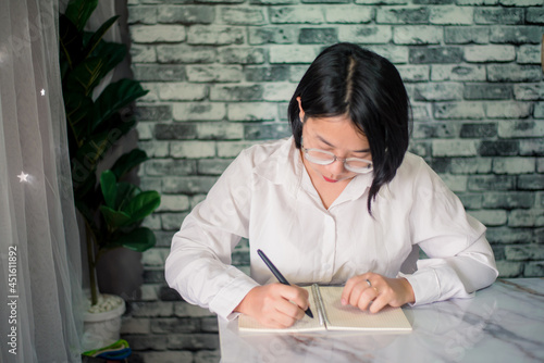 Portrait of happy businesswoman working at home with laptop on desk