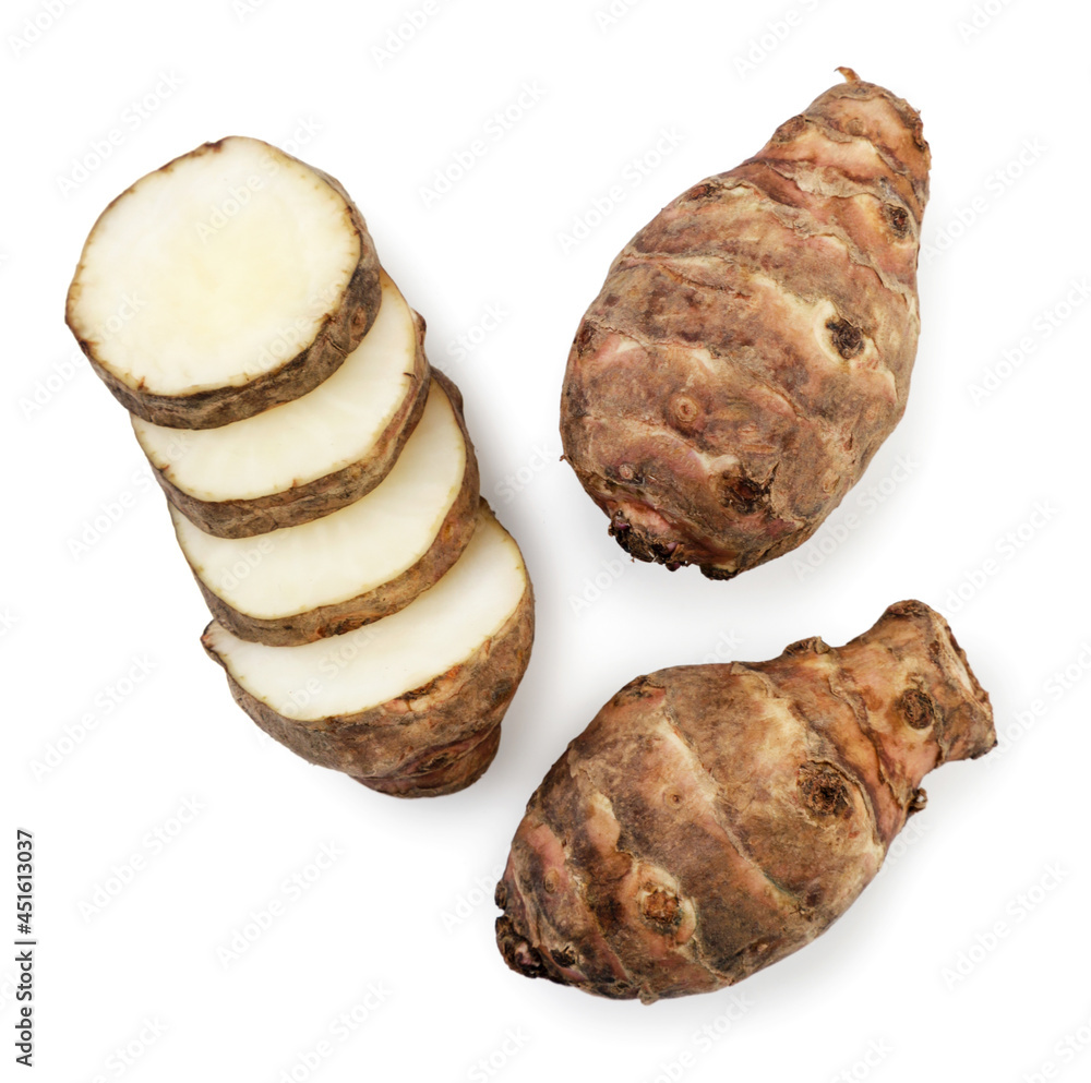 Jerusalem artichoke whole and slices on a white background, isolated. Top view Jerusalem artichoke whole and slices on a white background, isolated. Top view