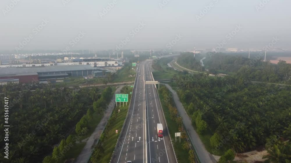 Aerial view highway PLUS of oil palm tree and factory at side. Aerial view highway PLUS of oil palm tree and factory at side.