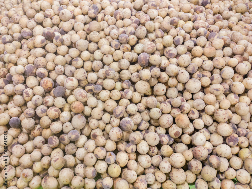 Asian fruit Langsat, Longkong, Duku, Lansium parasiticum, Lanzones or Lansones on sale at market Asian fruit Langsat, Longkong, Duku, Lansium parasiticum, Lanzones or Lansones on sale at market