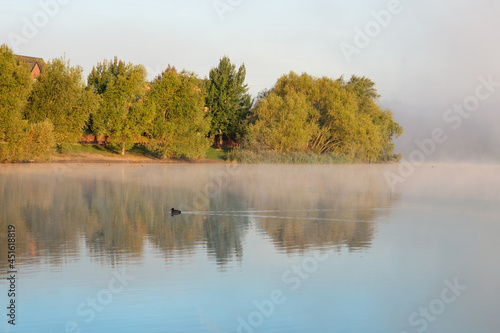 autumn morning on the lake with fog