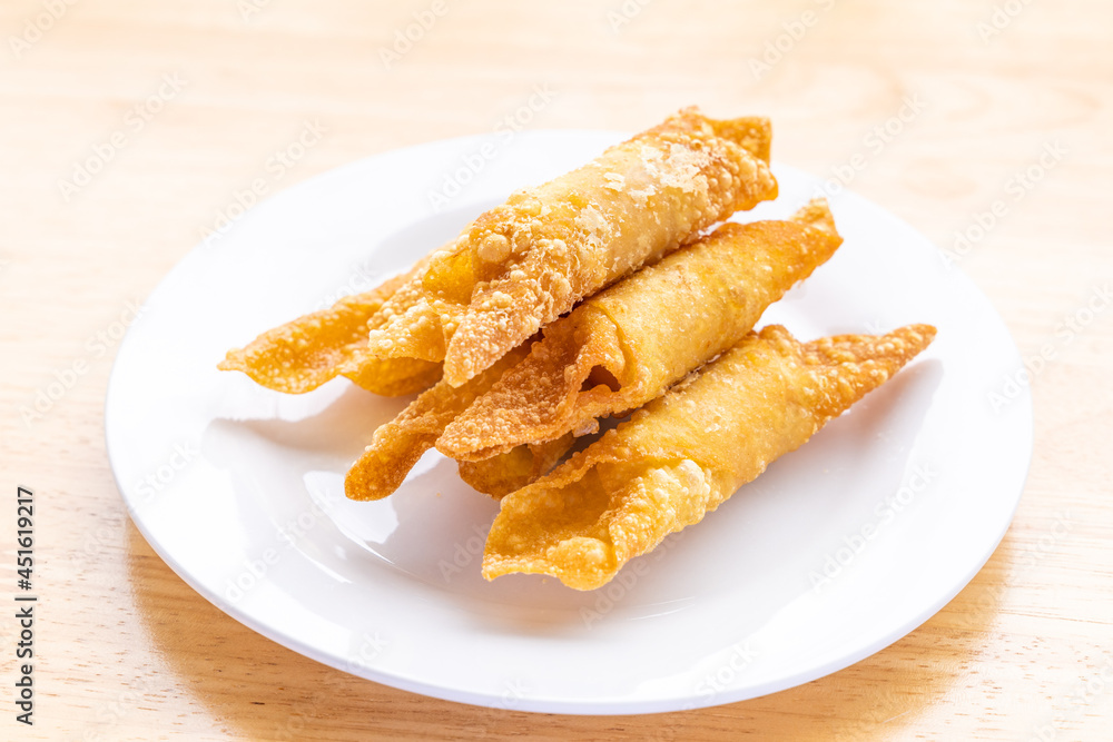 Thai Fried wontons in white plate on the table. Thai Fried wontons in white plate on the table.