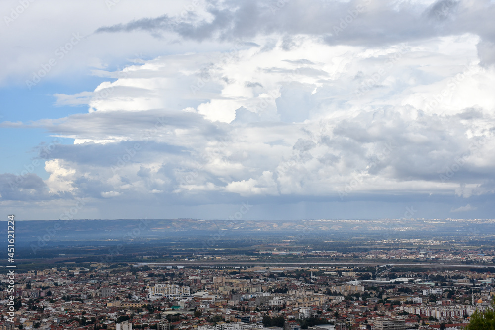 Aerial view of Blida city on a cloudy day from Chrea National Park, Algeria.