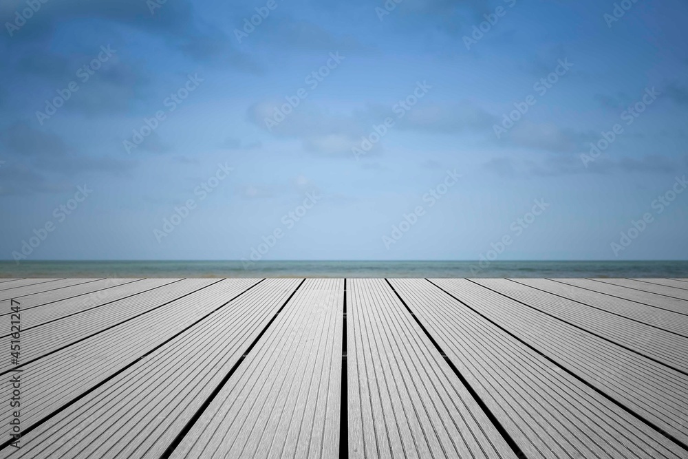 Wood perspective on sea image background. Empty top of wooden table. wood table top on blurred blue sea Wood perspective on sea image background. Empty top of wooden table. wood table top on blurred blue sea