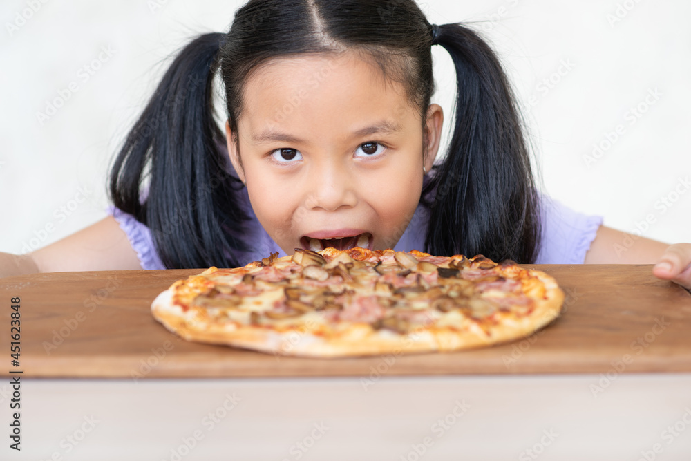 Asian children girl surprised with pizza Asian children girl surprised with pizza