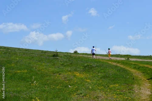 people on a hiking trail in the mountains