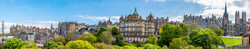 A panorama view from Princes Street Gardens towards the buildings on the Royal Mile in Edinburgh, Scotland on a summers day