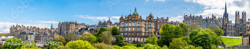 A panorama view from Princes Street Gardens towards the buildings on the Royal Mile in Edinburgh, Scotland on a summers day photo
