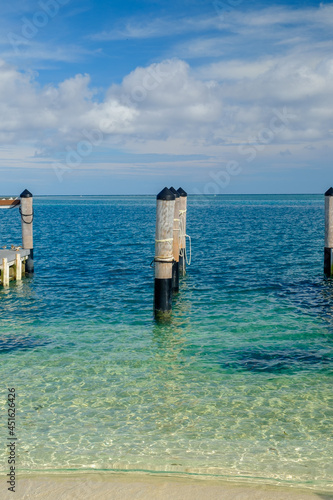 The old Coal ship docking pilings in the crystal clear waters of the Gulf of Mexico