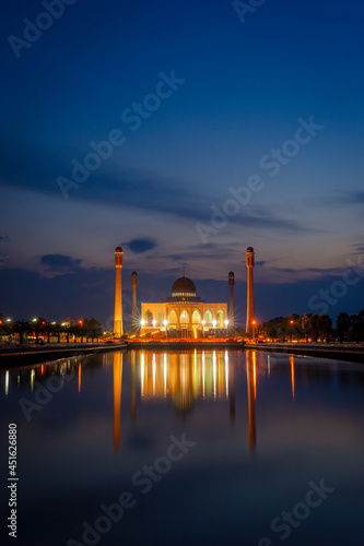 The lights in front of the Central Songkhla Mosque reflect the water at twilight