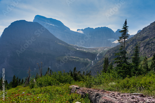 lake and waterfall in the mountains, Glacier national park