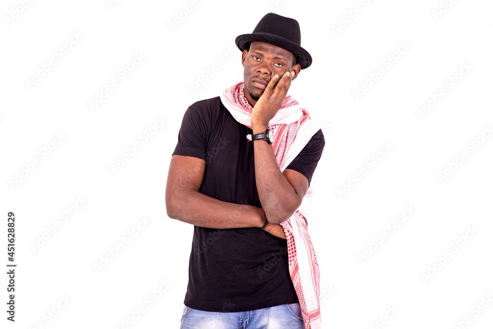 handsome pensive young man crossing his arms. handsome pensive young man crossing his arms.