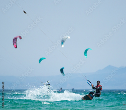 young man practicing kite surfing