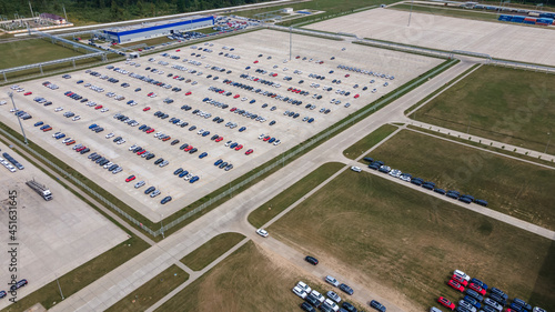 Aerial view of modern factory. Industrial territory and many cars nearby from above. Industrial concept.