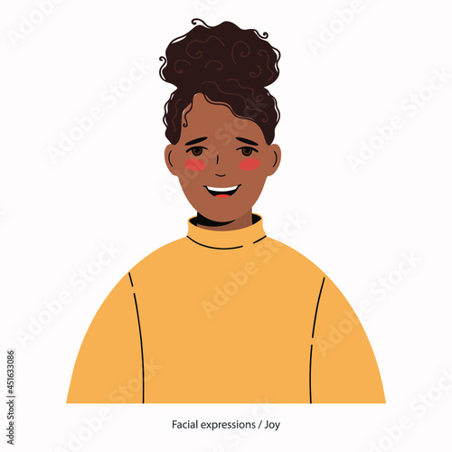 Expression on the face of a pretty African-American woman: joy.	