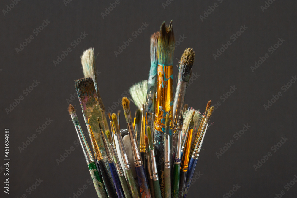 Dirty Paint brushes closeup on gray background Dirty Paint brushes closeup on gray background