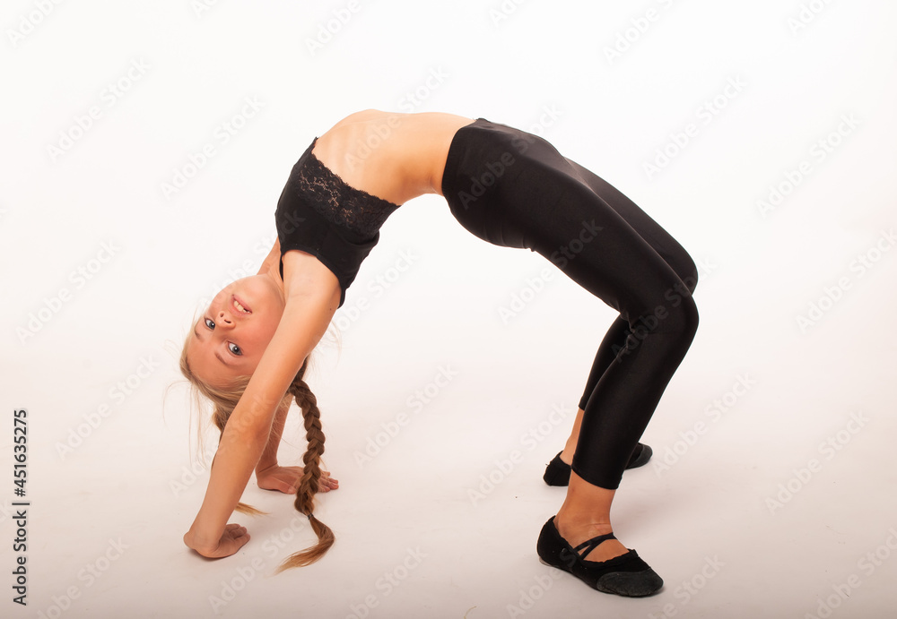 girl of European appearance makes a bridge on a white isolated background. Place for an inscription. Variety day, healthy lifestyle. girl of European appearance makes a bridge on a white isolated background. Place for an inscription. Variety day, healthy lifestyle.