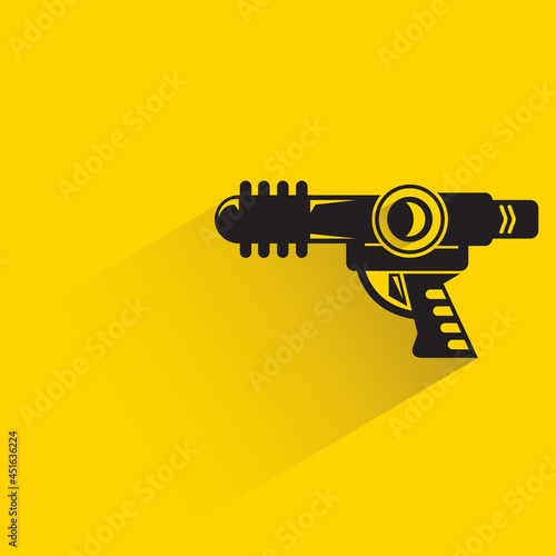 space blaster gun or fantastic raygun icon on yellow background