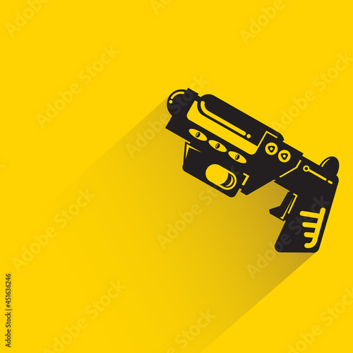space blaster gun or fantastic raygun icon on yellow background