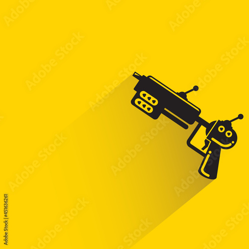 space blaster gun or fantastic raygun icon on yellow background