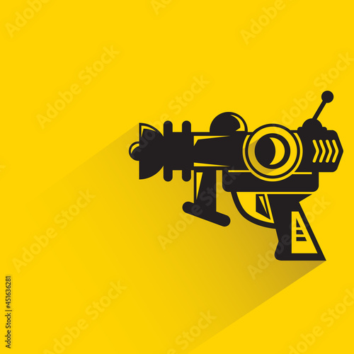 space blaster gun or fantastic raygun icon on yellow background