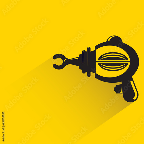 space blaster gun or fantastic raygun icon on yellow background