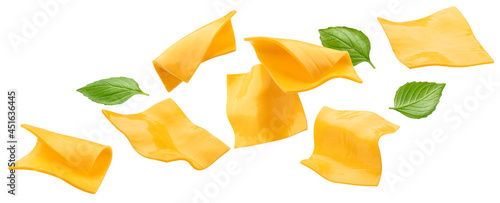 Square slices of processed cheese isolated on white background