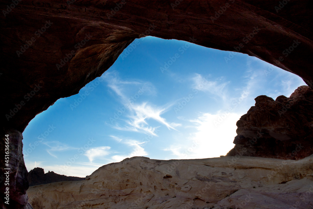 blue sky through a cave opening. Sky view in opening of cave. 