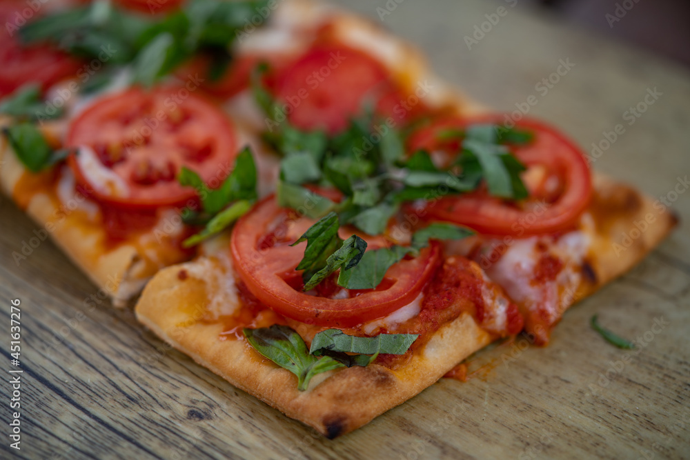 Blurred Margarita flatbreads (Margherita Pizza). Close up view.