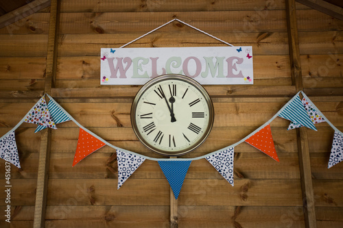 Buntin and welcome sign with a clock  photo