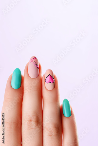 Beautiful colored nails manicure. Manicured nails and Soft hands skin wide banner. Beauty treatment. High quality photo