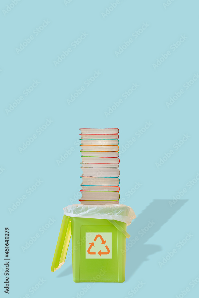 Cover page with green garbage trash bin with bag and a pile of